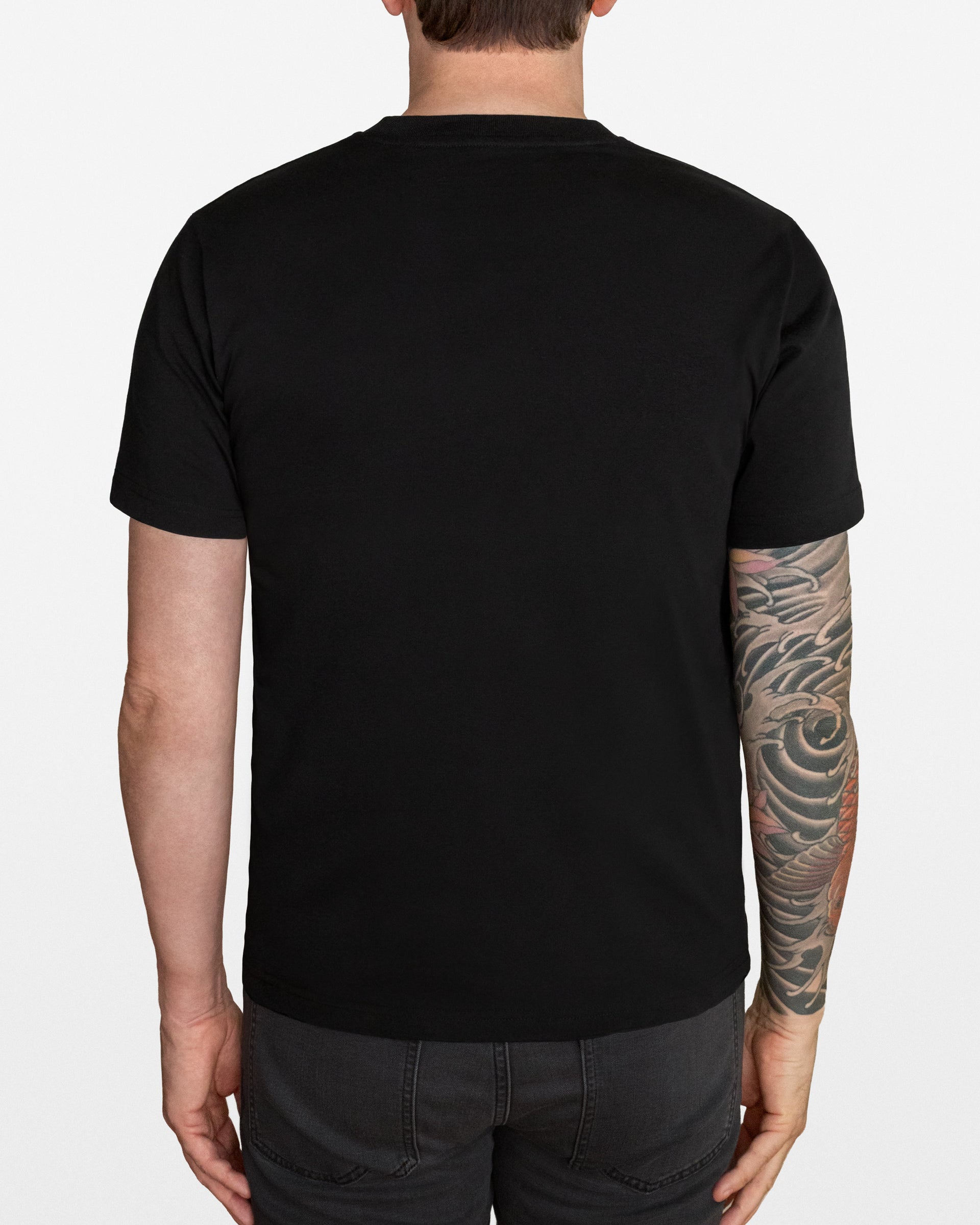 Person wearing a black t-shirt on a white background
