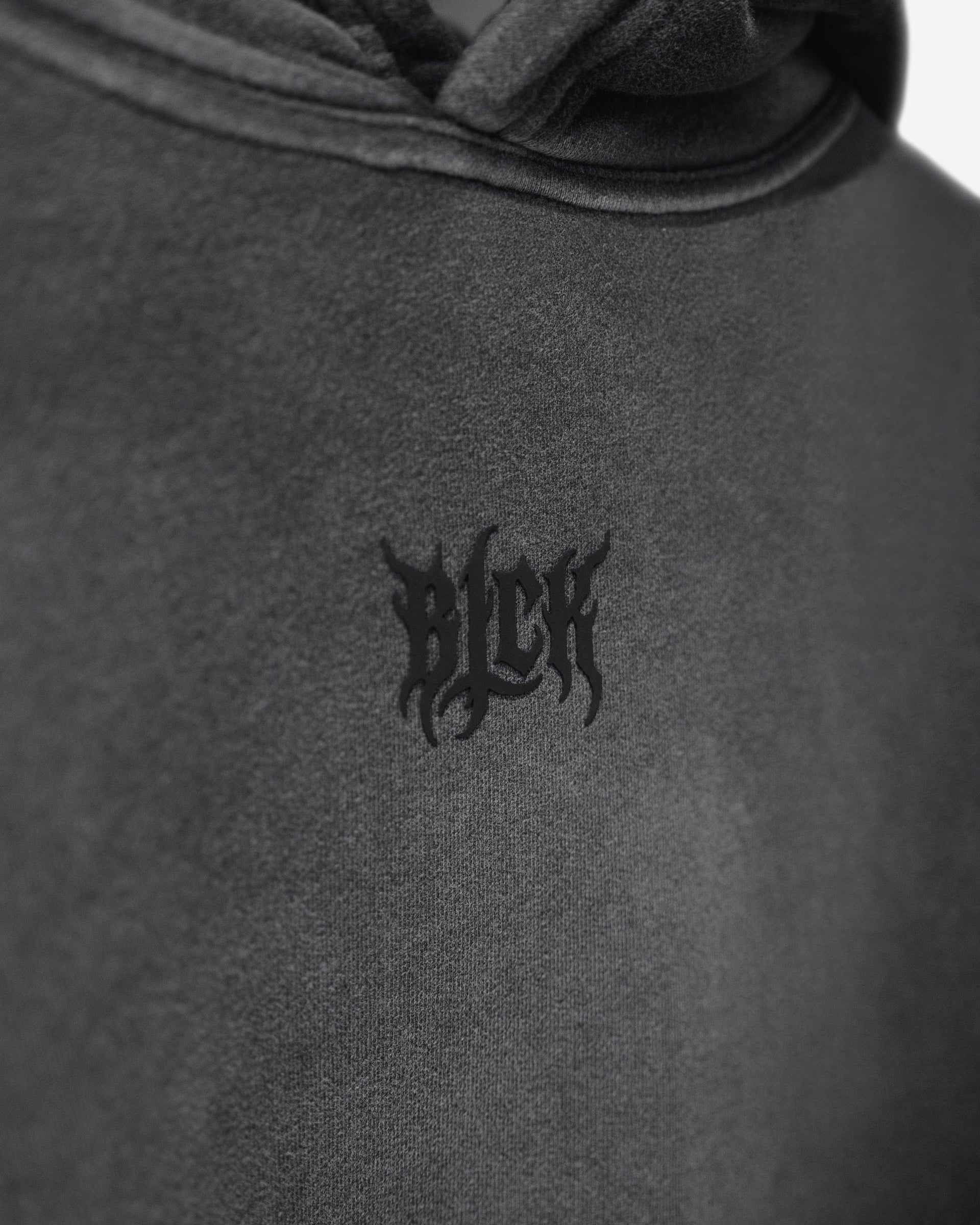 Silicone logo print on sun faded hoodie chest