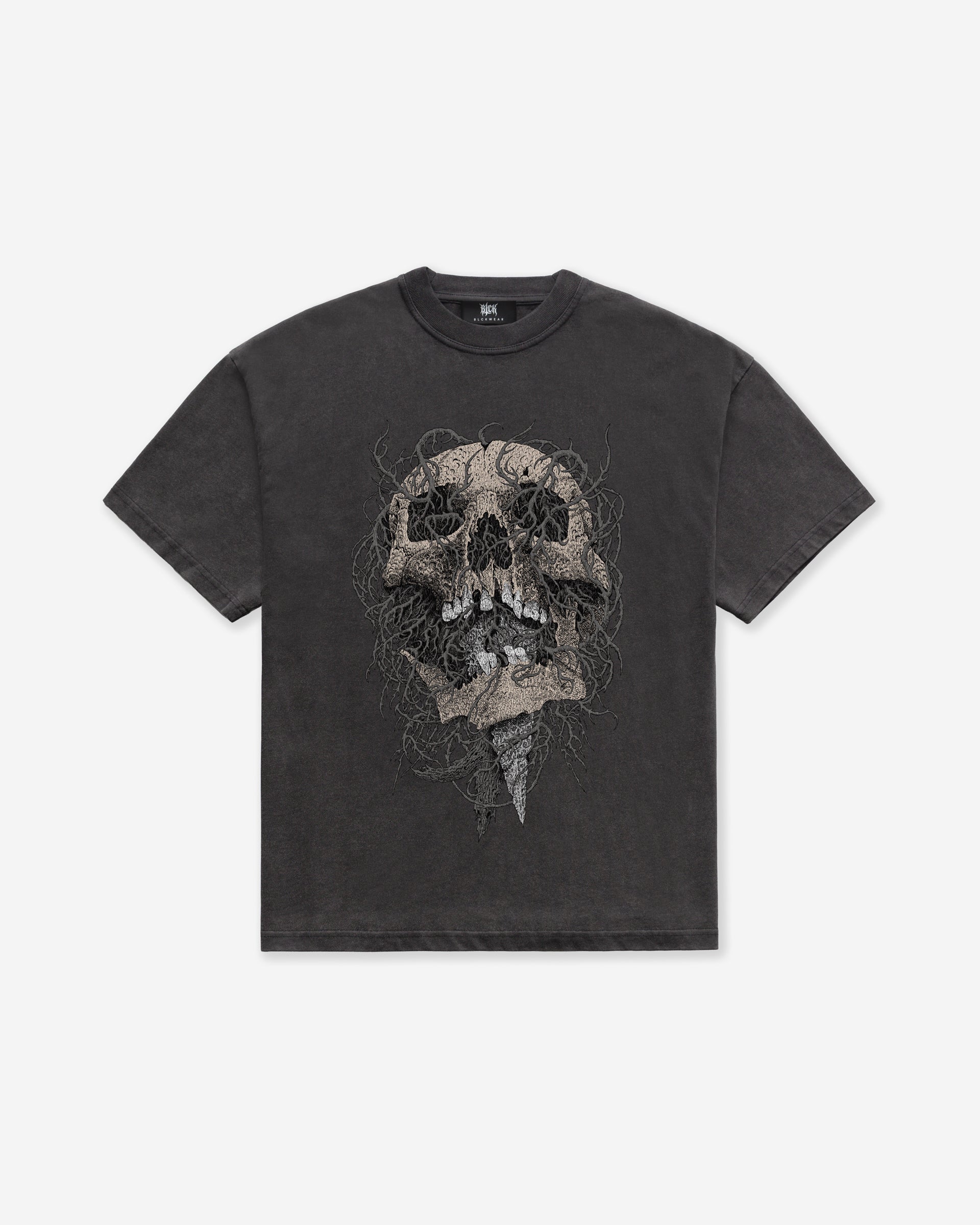A dark gray acid wash oversized t-shirt with an intricate skull design, on a white background
