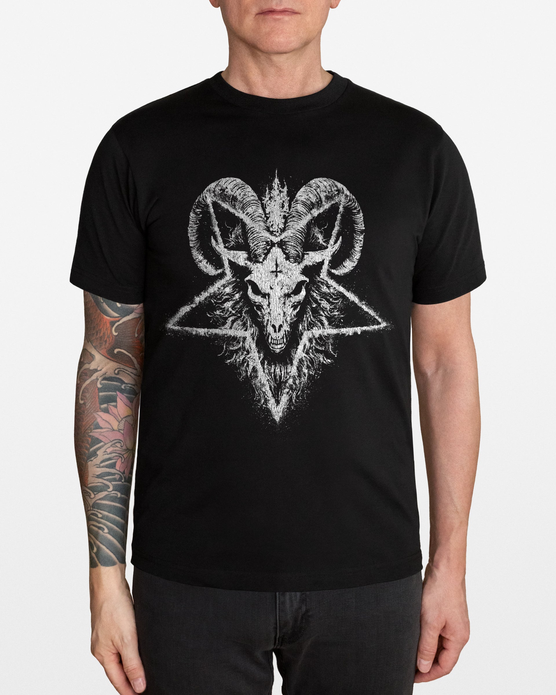 Person wearing a black t-shirt with a white satanic goat head and pentagram design, on a white background