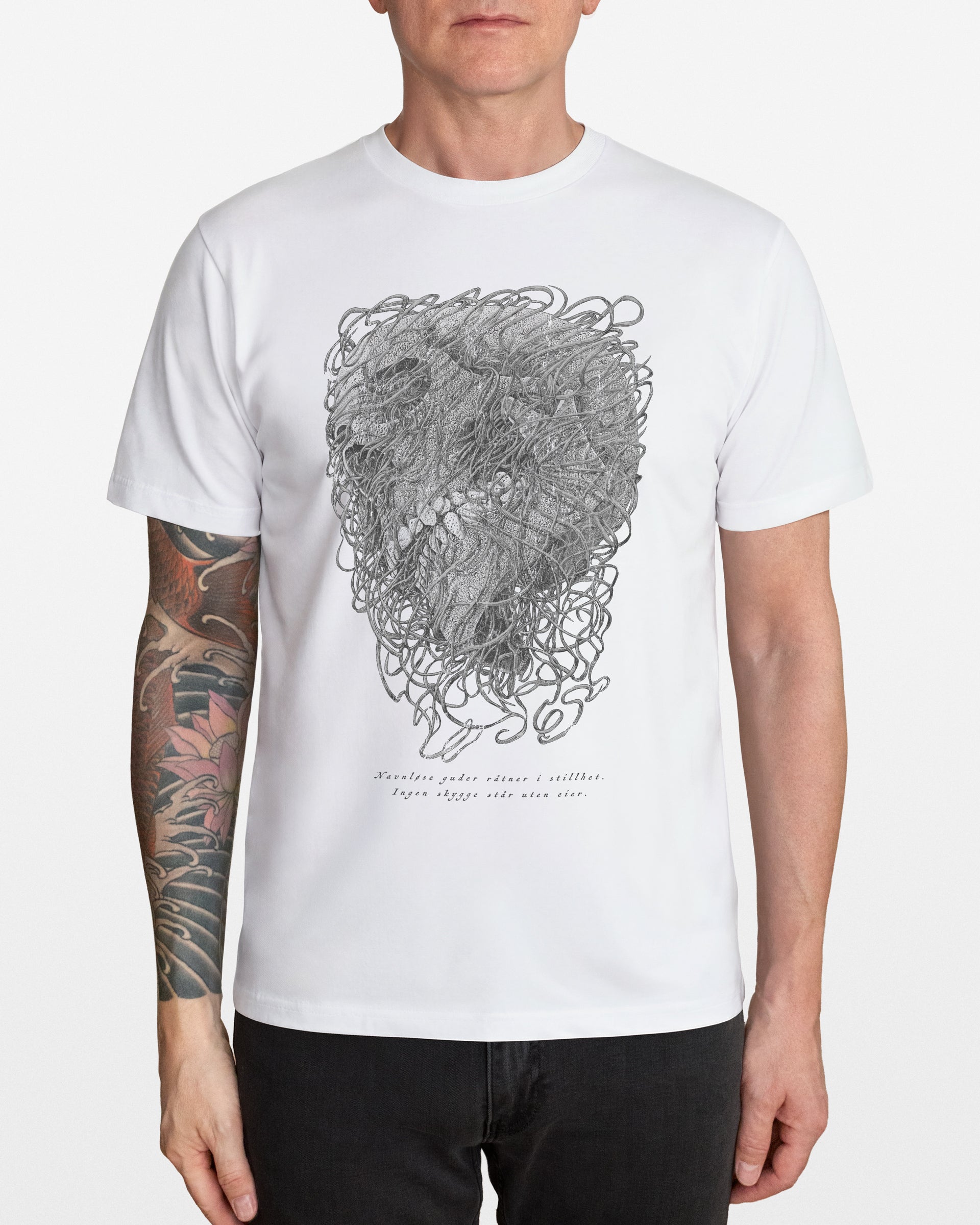 Person wearing a white t-shirt with a detailed skull design, on a white background
